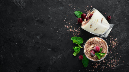 Dessert Tiramisu with cherries. Top view. Free space for your text. - obrazy, fototapety, plakaty