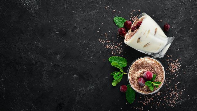 Dessert Tiramisu with cherries. Top view. Free space for your text.
