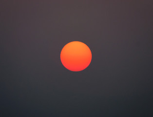 Red sun during dusk 