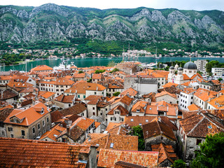 Naklejka na ściany i meble Kotor town, unesco heritage list. Montenegro. Beautiful panorama of orange roofs of medieval town.