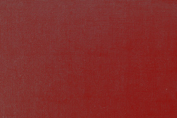 Red cherry background with  grid pattern. Canvas texture of old book cover. Toned image