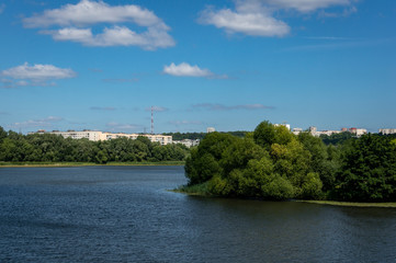 Landscape with a view to high-rise residential buildings located behind the water surface of the Sviyaga River in Ulyanovsk