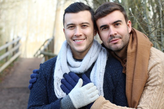 Homosexual couple outdoors with copy space
