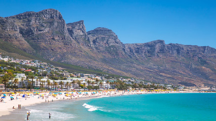 View Camps bay beautiful beach with turquoise water and mountains in Cape Town, South Africa