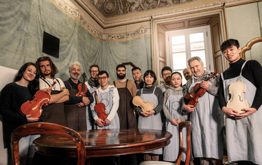 group of people teachers and students violin maker