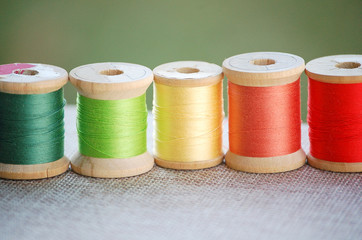 Antique Wooden Spools of Colorful Sewing Thread