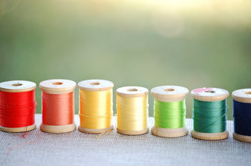 Antique Wooden Spools of Colorful Sewing Thread