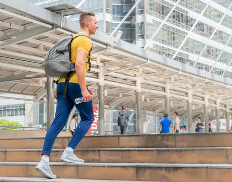 Male Sport Man Is Walking Up The Stair In Modern City