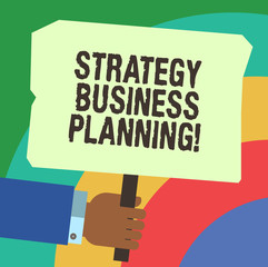 Handwriting text writing Strategy Business Planning. Concept meaning Outlines an organization s is overall direction Hu analysis Hand Holding Blank Colored Placard with Stick photo Text Space