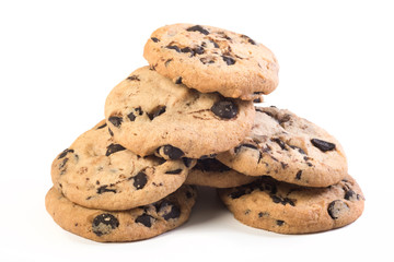 A pyramid of chocolate cookies, a close-up at the white background. Homemade pastry.