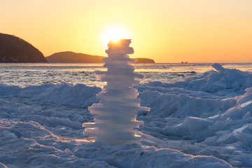 pyramid of pieces of ice at sunset