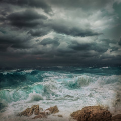Stormy sea view  near coastline at evening time. Waves, splashed 