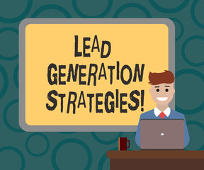 Writing note showing Lead Generation Strategies. Business photo showcasing Initiation of consumer interest into products Bordered Board behind Man Sitting Smiling with Laptop Mug on Desk