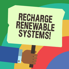 Handwriting text writing Recharge Renewable Systems. Concept meaning Clean and sustainable energy and nonpolluting Hu analysis Hand Holding Blank Colored Placard with Stick photo Text Space