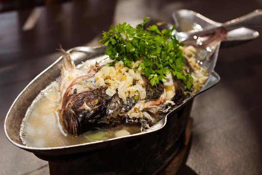 Most popular Thai seafood, steamed fish with lemon sauce.