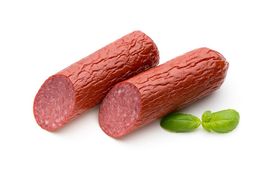 Salami smoked sausage, basil leaves on white background cutout.