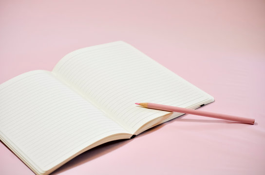 Blank Lined Journal on Pink Background