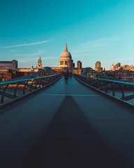 Foto op Aluminium Millennium Bridge St Paul's Cathedral on modern London city skyline blue sky © Tom Eversley