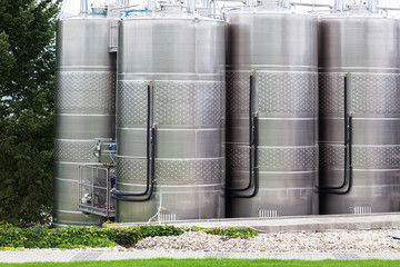 Modern wine factory with large tanks.