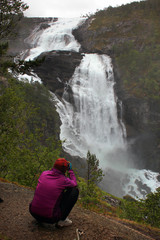 Fototapeta premium Photographer in Husedalen valley, Kinsarvik, Norway