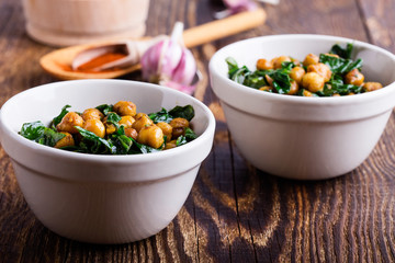 Spinach with chickpeas salad bowl