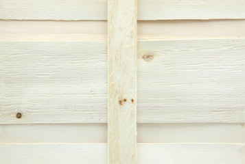 láminas horizontales y vericales de madera clara, fondo de caja de madera