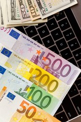 Background with american dollar and euro bills.