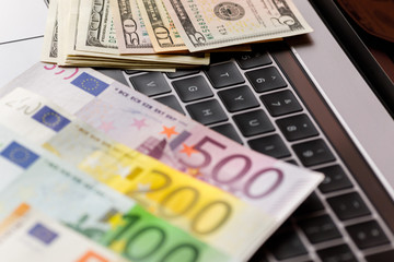 Background with american dollar and euro bills.