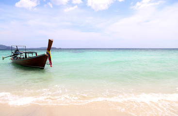 Fototapeta na wymiar Wooden boat on sea beautiful in holiday at Andaman sea Phuket Thailand