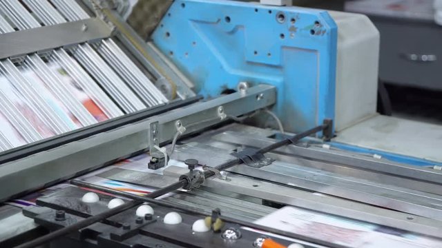 close up typography equipment in print office machine prints brochure