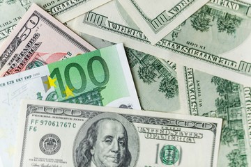 Background with american dollar and euro bills.