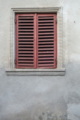 Fototapeta premium Window on the façade of a stone wall
