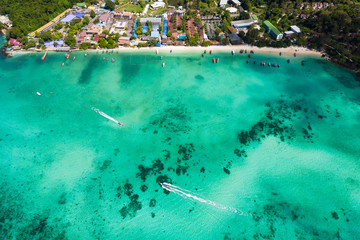 hi season boat and tourists on phiphi island Krabi Thailand aerial view from drone