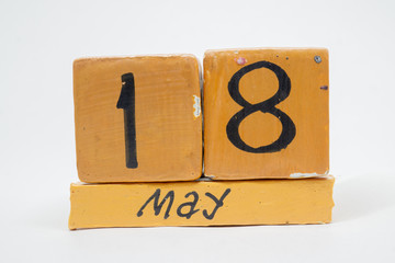 may 18th. Day 18 of month, handmade wood calendar isolated on white background. Spring month, day of the year concept