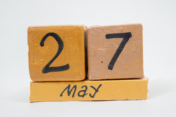 may 27th. Day 27 of month, handmade wood calendar isolated on white background. Spring month, day of the year concept