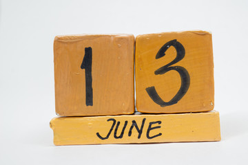 june 13th. Day 13 of month, handmade wood calendar isolated on white background. summer month, day of the year concept