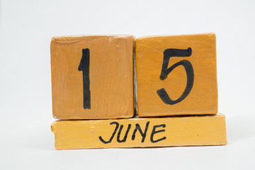 june 15th. Day 15 of month, handmade wood calendar isolated on white background. summer month, day of the year concept