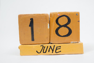 june 18th. Day 18 of month, handmade wood calendar isolated on white background. summer month, day of the year concept