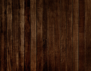 The texture of the wooden walls of the old house a dark color