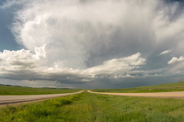 Fototapeta na wymiar A supercell thunderstorm over the highway in South Dakota