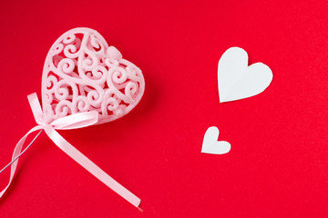 background for Valentine's day and eighth of March, red heart on red background