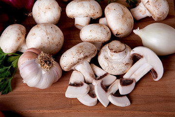  Fresh mushrooms on a wooden background.