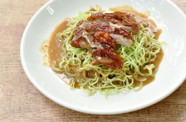 Chinese egg noodles topping slice roasted duck with soybean sauce