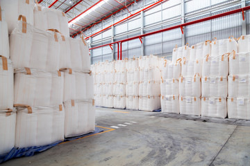 Stacking of bulk cargo in jumbo bags are store in warehouse for distribution to customer, import export logistics business.