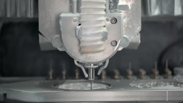 Closeup view at carving process in dental milling machine