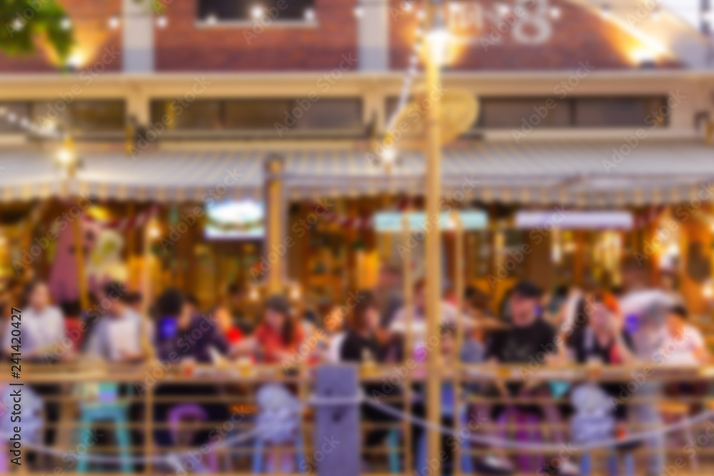 Poster abstract blur image of night festival in a restaurant and the atmosphere is happy and relaxing with 