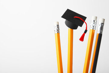 Graduation cap on pencils. Education, study and learn concept.