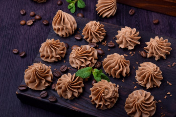 Coffee creamy fudge on a dark wooden board
