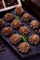 Coffee creamy fudge on a dark wooden board