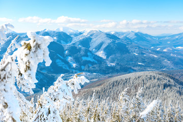 Winter landscape in mountains with snow and blue hills